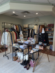 Elegant boutique interior with clothes and accessories displayed